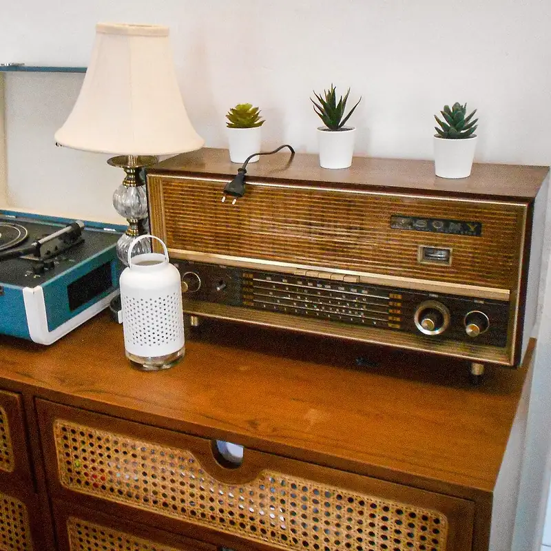 A retro turntable and vintage radio on a sideboard (illustrative photo, not the product)